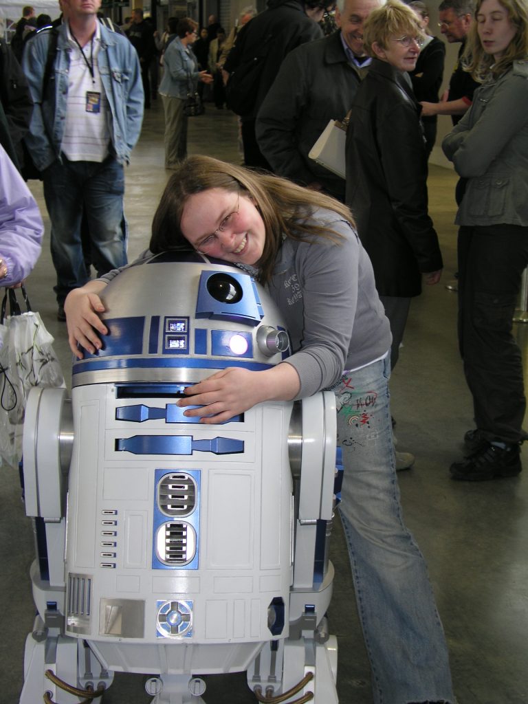 Girl hugging R2D2 - Star Wars