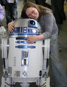 Girl hugging R2D2 - Star Wars